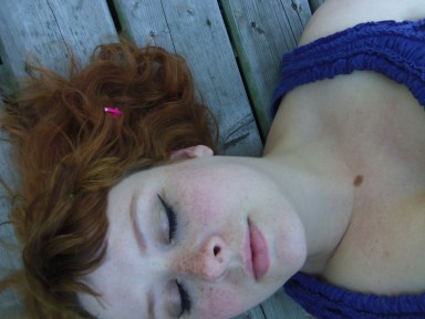freckled redhead on dock