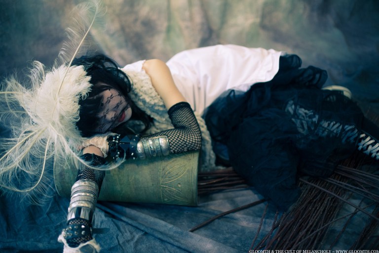 high fashion feather hat goth gothic eerie