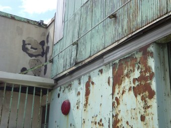 mint green rusted building