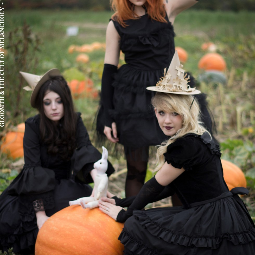 gothic girls witch in pumpkin patch