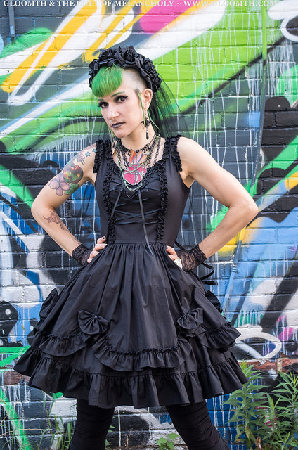 gothic model against a colorful graffiti wall background toronto