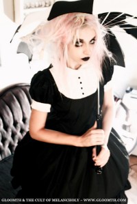 gothic halloween photoshoot with pink hair model and black and white lolita dress
