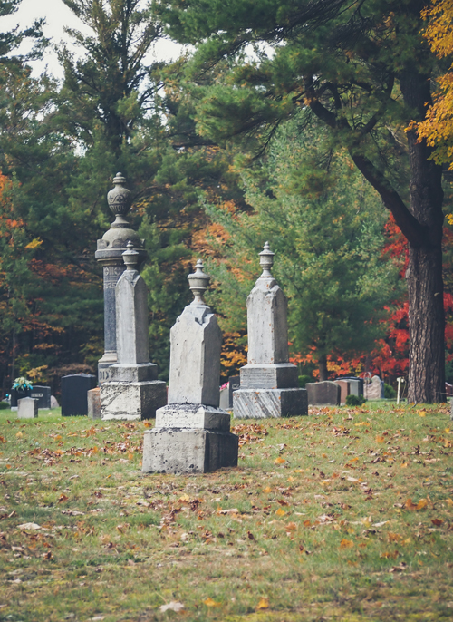 victorian tombstones in autumn graveyard cemetery