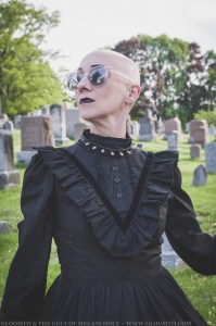 bald gothic woman in victorian dress