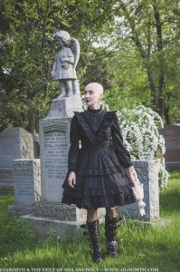 bald gothic wioman in victorian cemetery