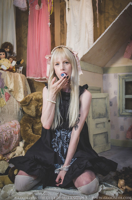 creepy dollhouse girl