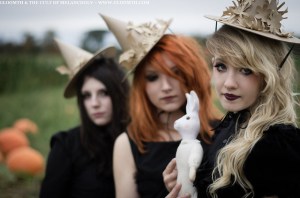 goth witches in pumpkin patch