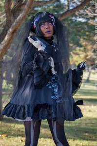 creepy dolly girl with blackened teeth