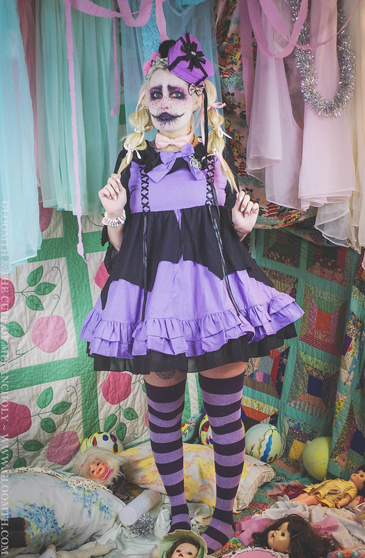 Creepy Kawaii Clown Girl in a purple and black dress. Jazmin bean makeup
