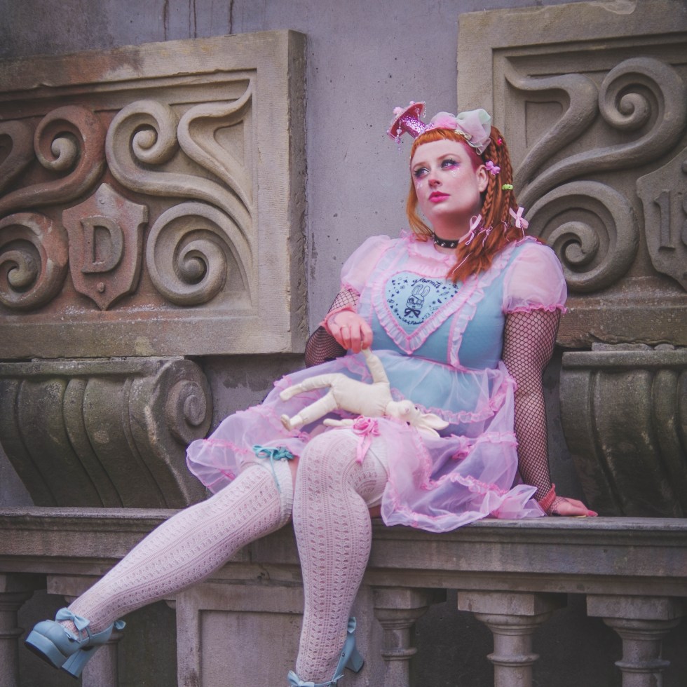 plus size lolita in a sheer pink dress