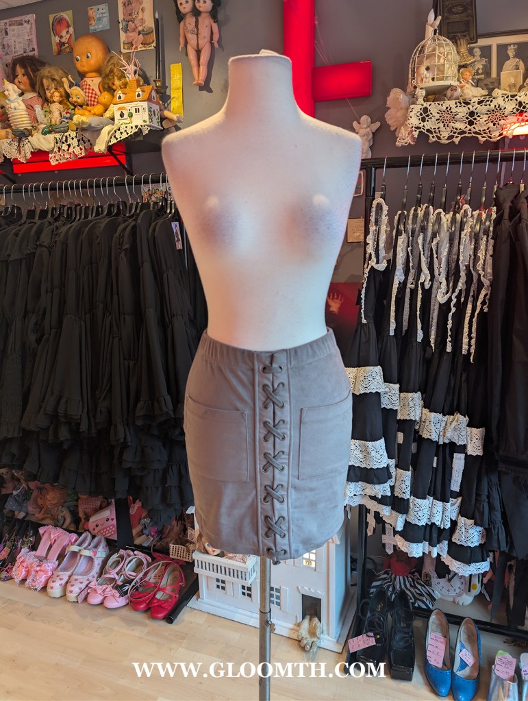 corset mini skirt doll funeral shop toronto