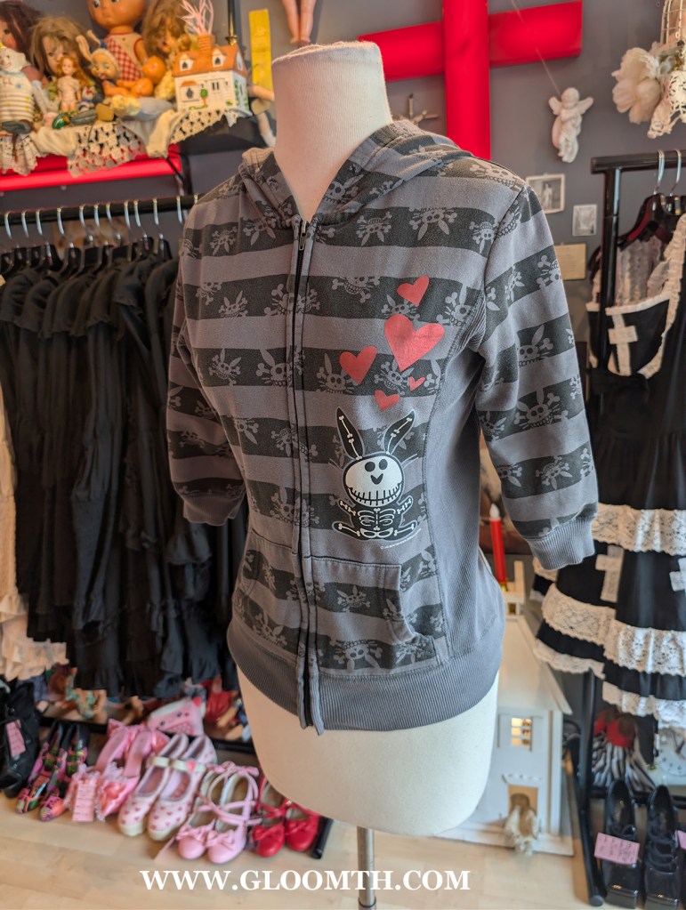 happy bunny emo mall goth hoodie  on display in doll funeral shop toronto