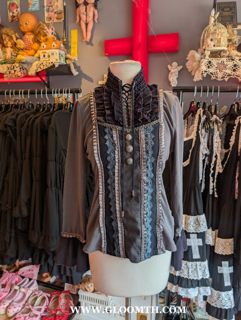 ozz angelo top  on display in doll funeral shop toronto