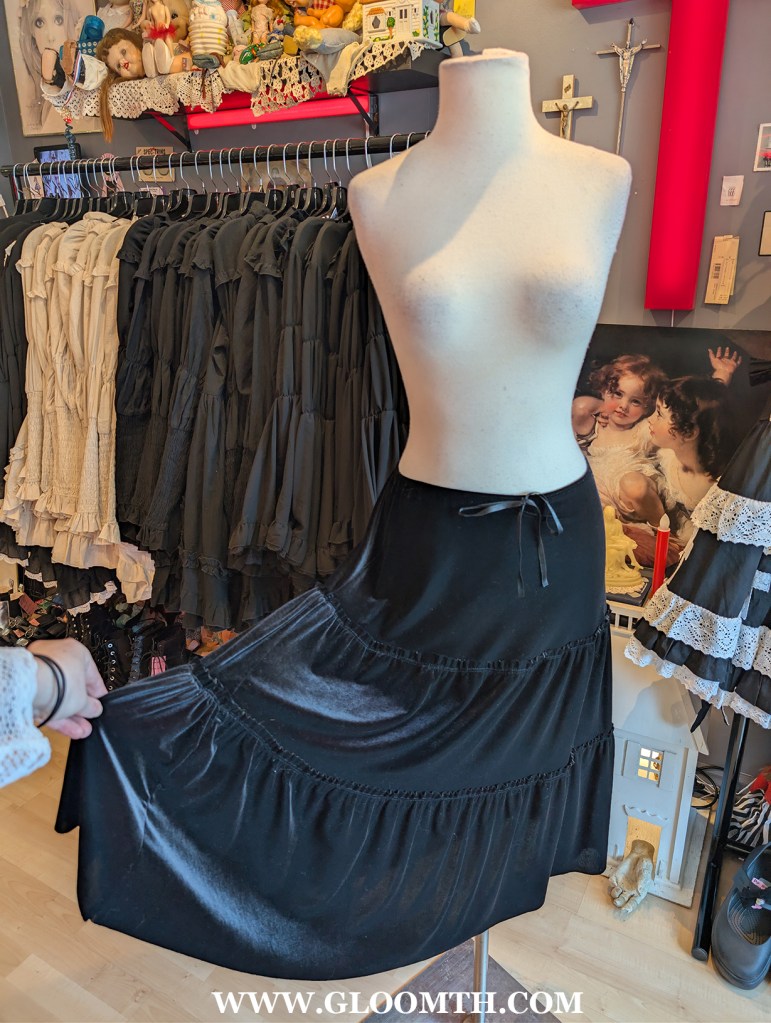 velvet y2k gothic skirt on display at doll funeral shop in toronto
