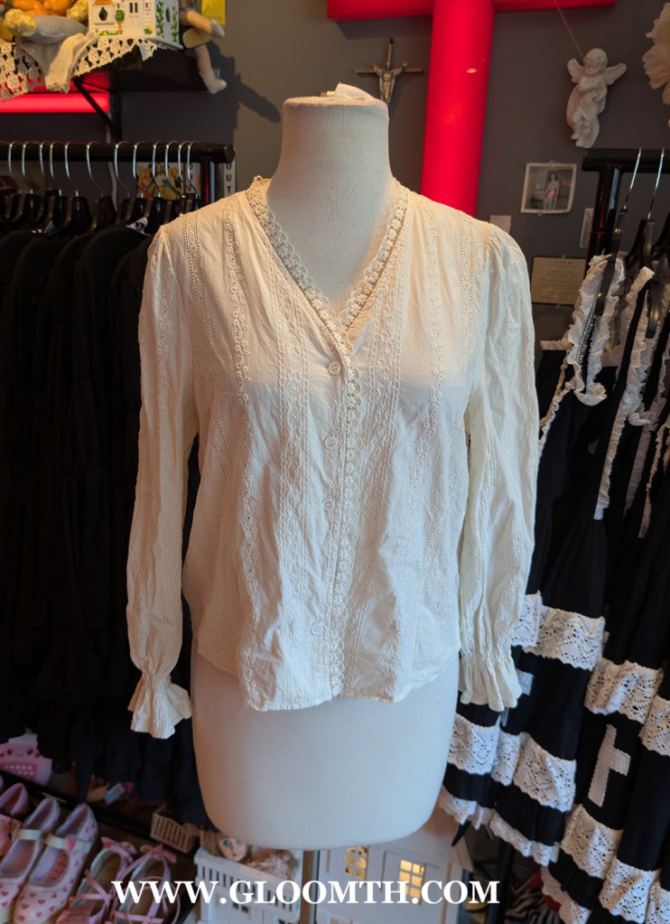 edwardian cotton blouse on display at doll funeral shop in toronto
